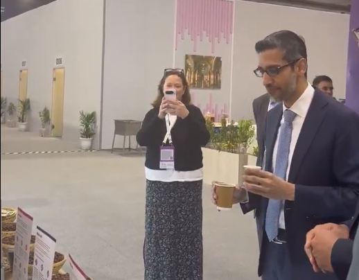 Sundar Pichai drinks coffee in Bharat GI Coffee lounge at India AI Summit 2026